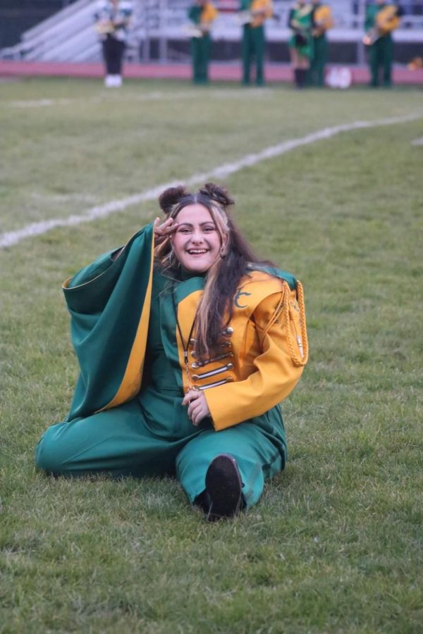 Alli smiles as she completes her iconic ending the 2022 field show