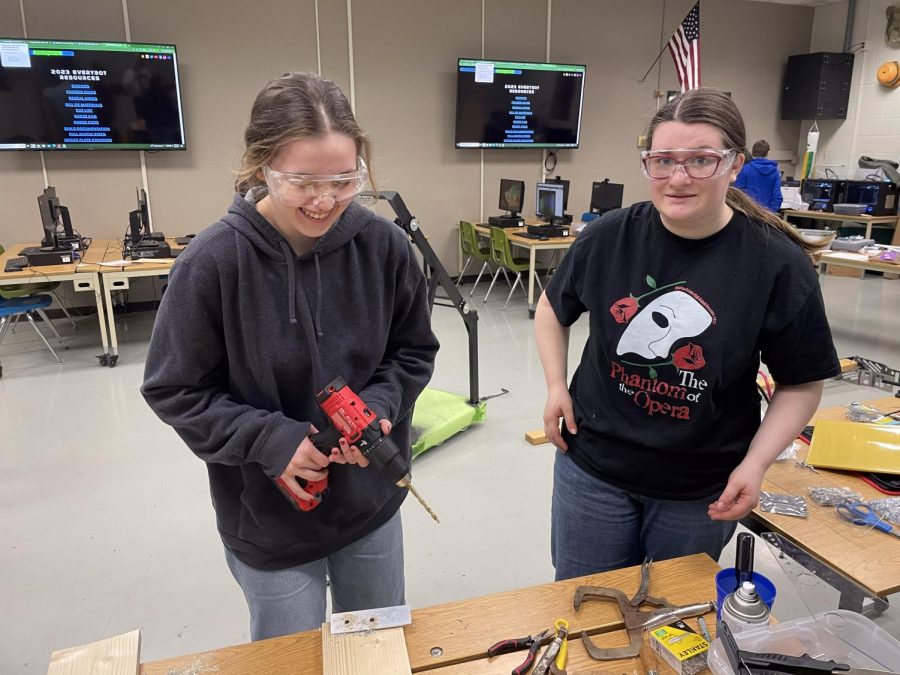 Girls in the Robotics Club work on building their robot for an upcoming competition 
