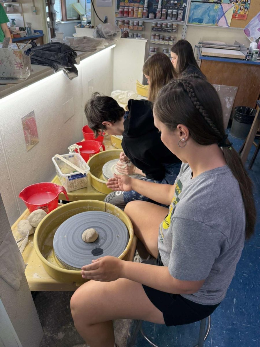 Pottery students creating their works